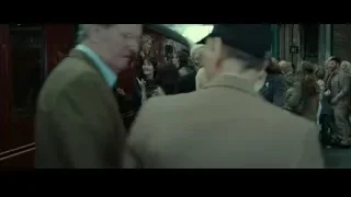 Man and woman embracing in train station — Harry Potter and the Deathly Hallows 2