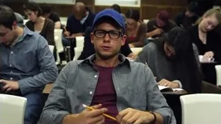 young man deep in thought in lecture hall — Suits