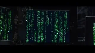 man at multiple monitors in control room — The Matrix
