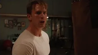 Young man standing in gym by punching bag — The Avengers