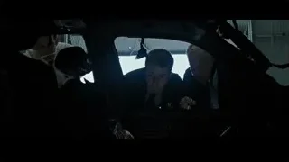 three men in suits in garage looking at car — Fight Club