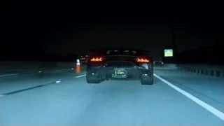 Car driving fast on highway at night — Sports Cars
