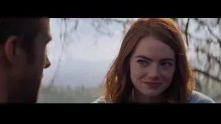 man and woman looking at each other — La La Land