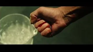 Bloody hand holding glass mug — Whiplash