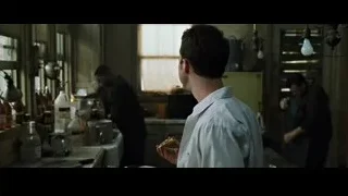 man working in a dimly lit kitchen — Fight Club