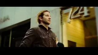 man standing in front of Prada building — Limitless