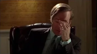 man sitting in office chair with head in hands — Breaking Bad