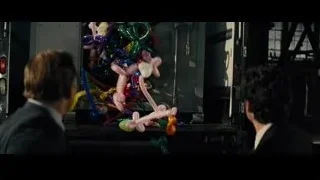 Two men with colorful balloons in factory — Now You See Me