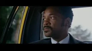 man in suit sitting in car — The Persuit of Happyness