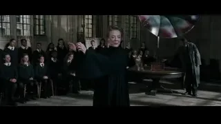 woman speaking to students with umbrella — Harry Potter and the Goblet of Fire