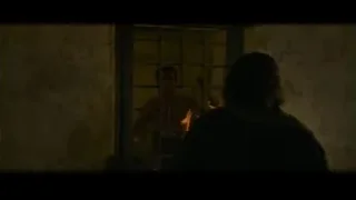 man and woman by window with bars — Gladiator 2