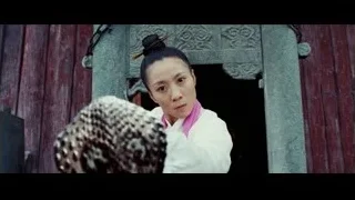 young woman in traditional outfit near red door — The Karate Kid