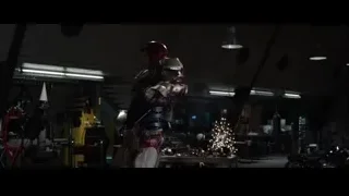 Iron Man holding gun in workshop — Iron Man 3