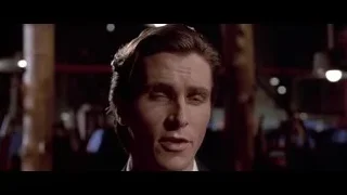 man's face in dimly lit room — American Psycho