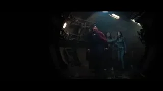 man in red cloak with sword in dark tunnel — Doctor Strange 2