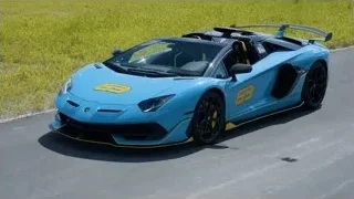blue Lamborghini sports car number 63 — Sports Cars