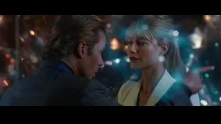 man and woman embracing in cityscape — Iron Man 3