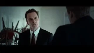 Man in suit standing in room serious expression — Steve Jobs