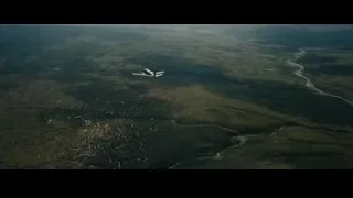 airplane flying over mountainous landscape — Batman: The Dark Knight Rises
