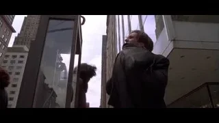 man in suit leaning against glass window — American Psycho