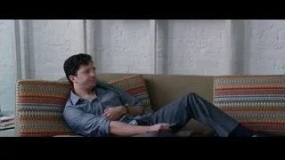 Two young men on couch with laptop — The Big Short
