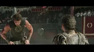 two men in ancient armor before crowd — Gladiator 2