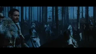 Man with sword in forest with group on horseback — Gladiator