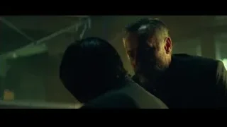 man and woman embracing in dark room — John Wick