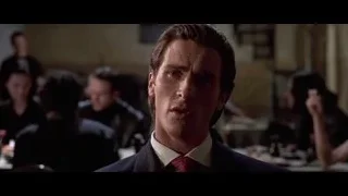 man and woman talking in dimly lit room — American Psycho