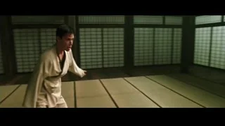 Two men in martial arts fight on tatami mats — The Matrix