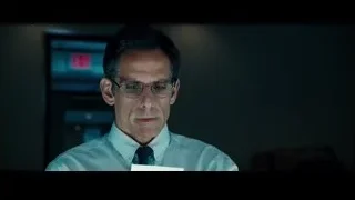 man in tie holding paper in office — The Secret Life of Walter Mitty