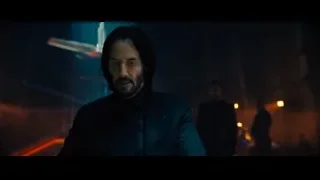 Man in suit in dimly lit room — John Wick: Chapter 4
