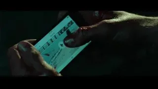 Hand holding smartphone playing beach video — John Wick