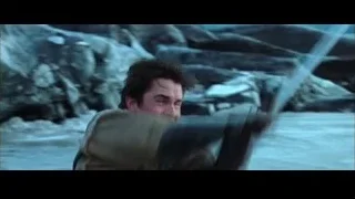 man at rocky cliff with snow — Batman
