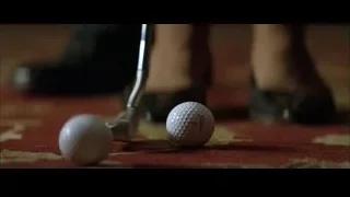 golf ball and putter on red carpet — Batman