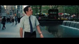 Golden statue of man and woman in city — The Secret Life of Walter Mitty