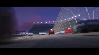 red car racing on track at night — Cars 3