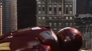 Iron Man fighting dinosaurs in cityscape — The Avengers