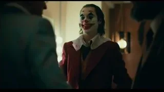 Joker in red suit looking at camera — Joker