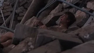 shirtless man lying on rubble — The Avengers