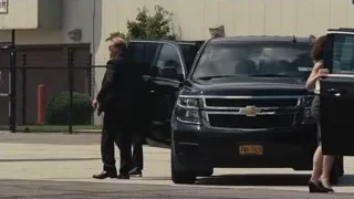 men walking towards black SUV — Succession