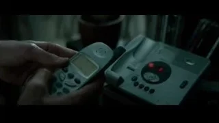 person holding remote control in dark room — Limitless