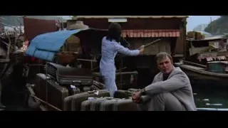 man and woman in small boat on river — Bruce Lee: Enter The Dragon