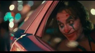 Joker's face in car rearview mirror — Joker