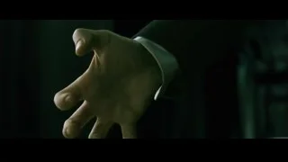 person's hand reaching out on tiled floor — The Matrix