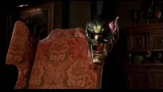 Menacing green mask on chair — Spider Man