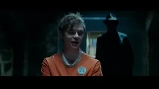 young man standing in dimly lit room — The Amazing Spider Man 2