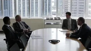 Four men in meeting room with city skyline — Suits