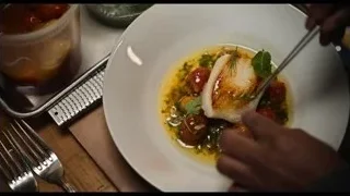 hands preparing food on plate — The Bear