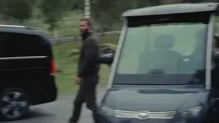 man in suit getting out of limousine — Succession